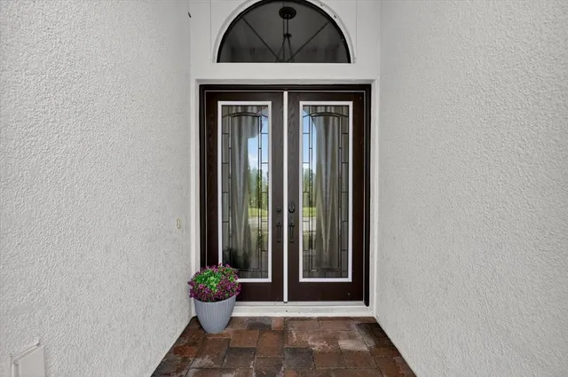 a view of living room filled with furniture and wooden floor