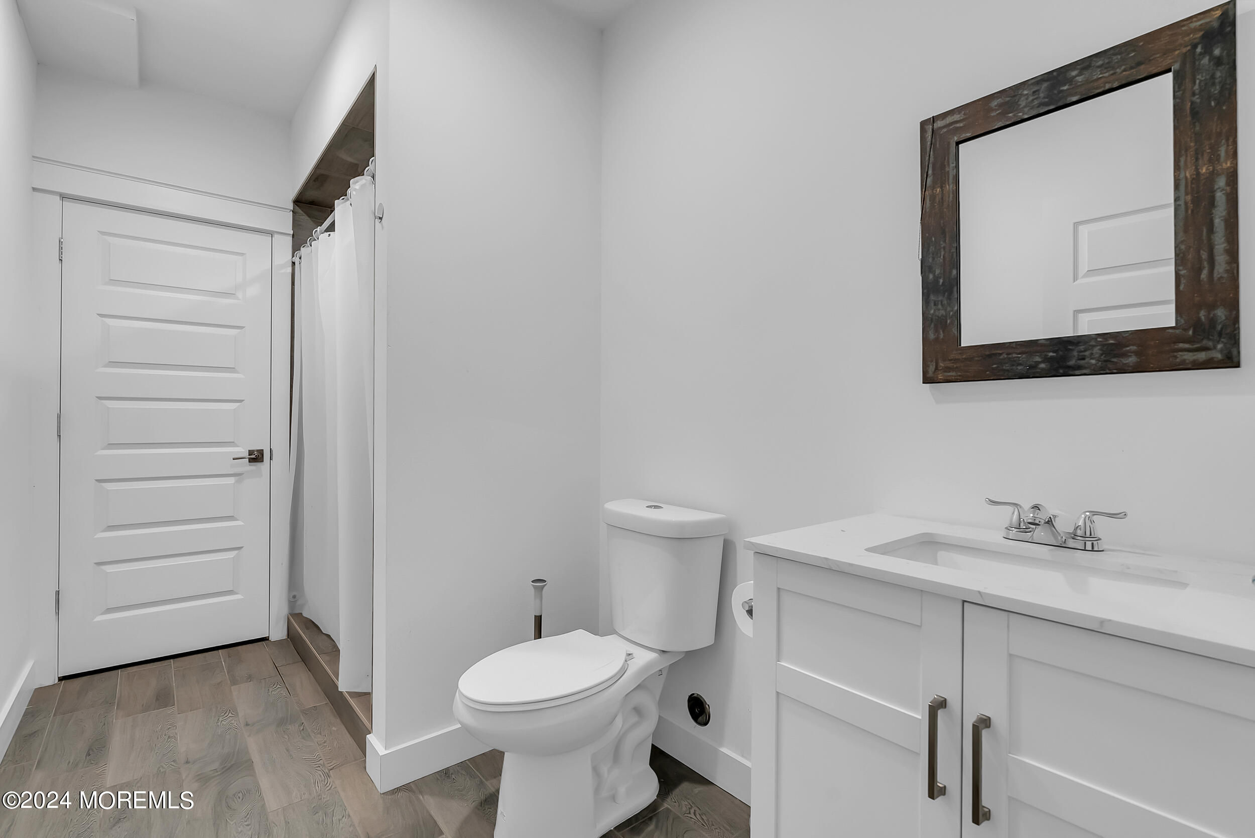 8 Sarah Lane Eatontown, NJ 07724 - Photo 19 of 53 a bathroom with a toilet sink and mirror
