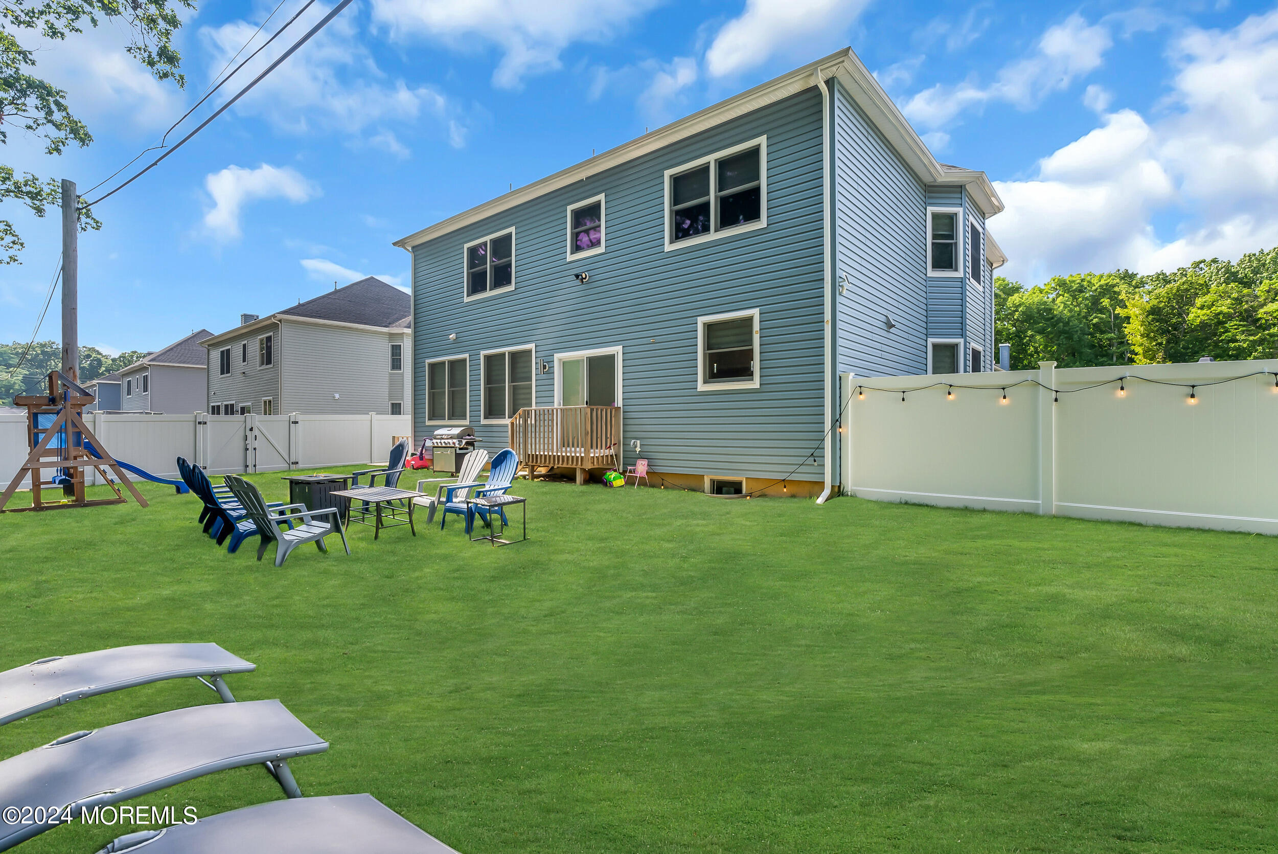 8 Sarah Lane Eatontown, NJ 07724 - Photo 30 of 53 a backyard of a house with table and chairs