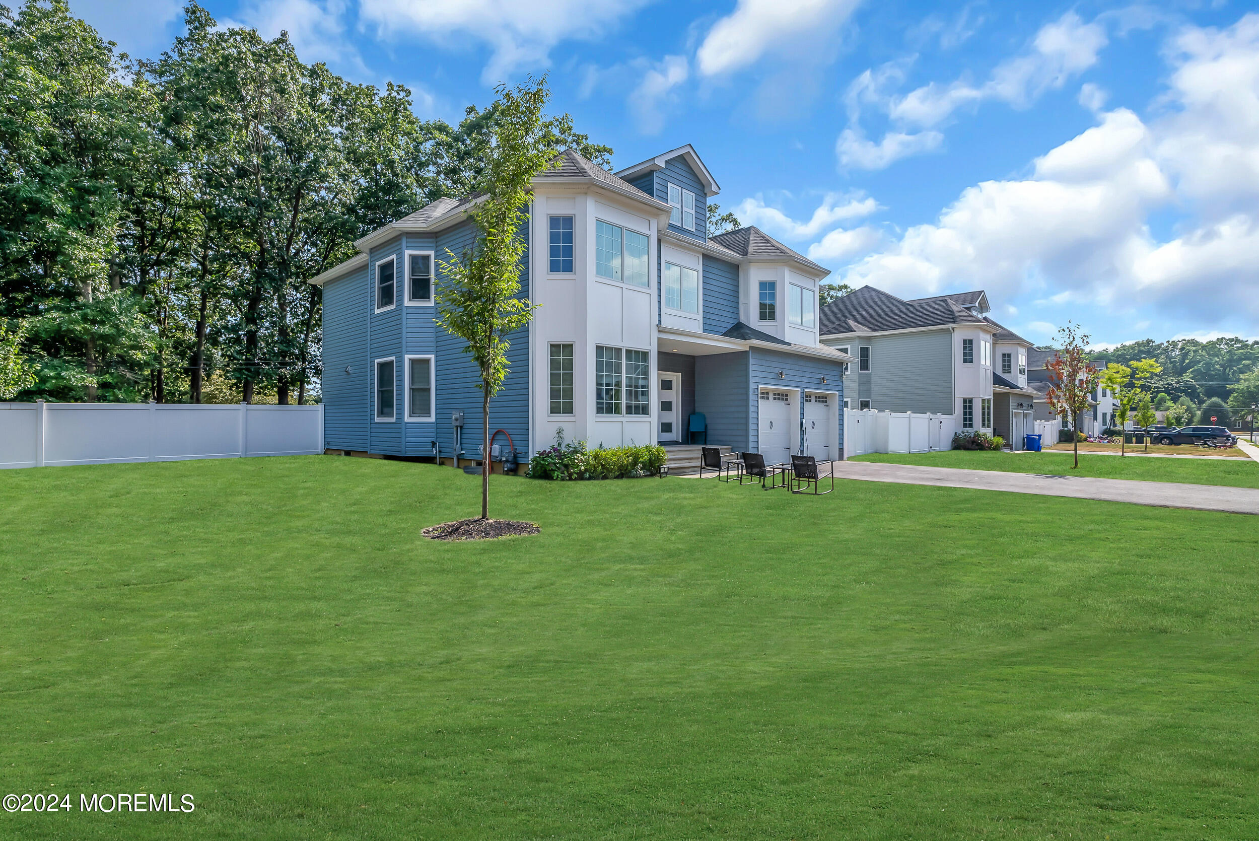 8 Sarah Lane Eatontown, NJ 07724 - Photo 7 of 53 a front view of a house with a yard
