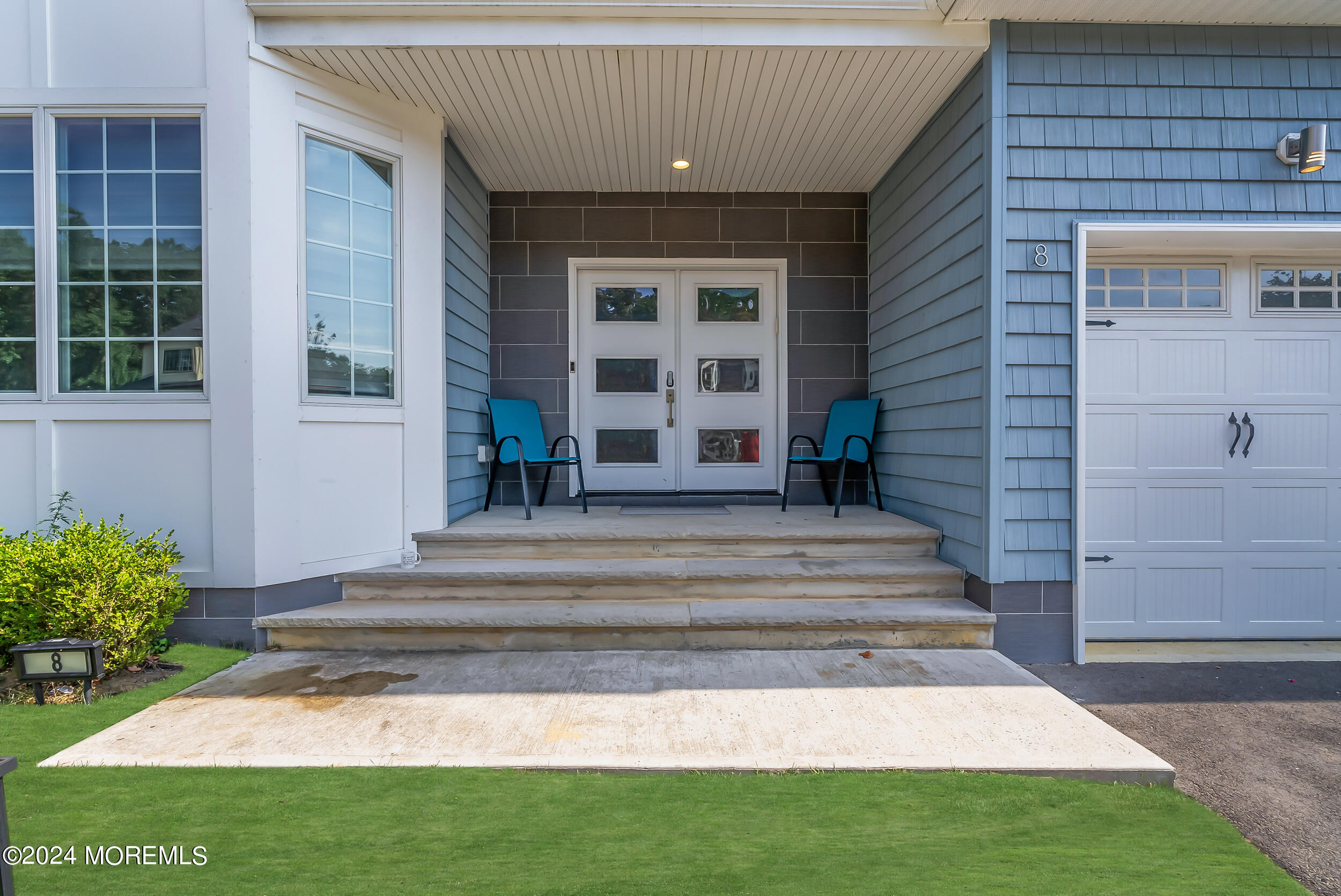 8 Sarah Lane Eatontown, NJ 07724 - Photo 9 of 53 a front view of a house with a porch