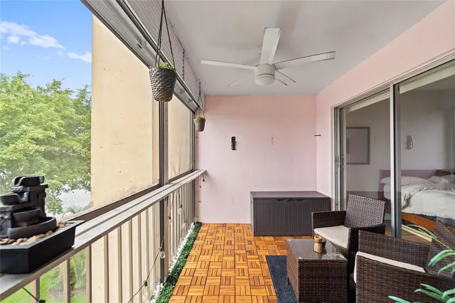 a view of a balcony with furniture