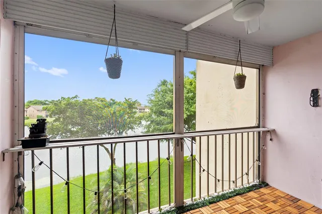 a view of a balcony with furniture