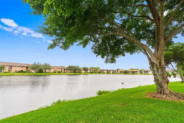 a view of lake with houses in the back