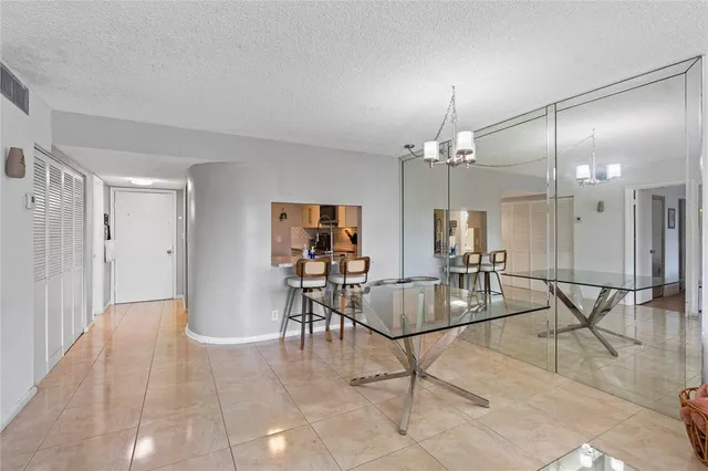 a view of a livingroom with furniture and dining table