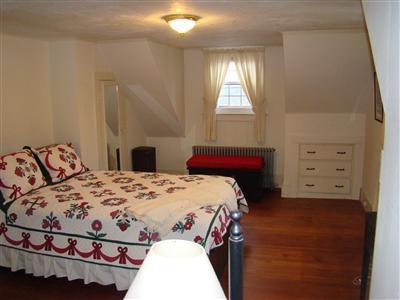 34 Benedict Road Bourne, MA 02532 - Photo 11 of 16 a bedroom with a bed and window