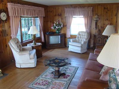 34 Benedict Road Bourne, MA 02532 - Photo 12 of 16 a living room with furniture and a large window