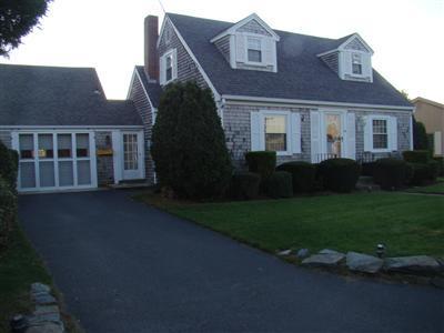 34 Benedict Road Bourne, MA 02532 - Photo 16 of 16 a front view of a house with a garden