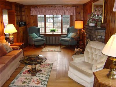 34 Benedict Road Bourne, MA 02532 - Photo 4 of 16 a living room with furniture and a fireplace