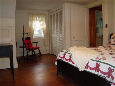 34 Benedict Road Bourne, MA 02532 - Photo 7 of 16 a bedroom with a bed and a window
