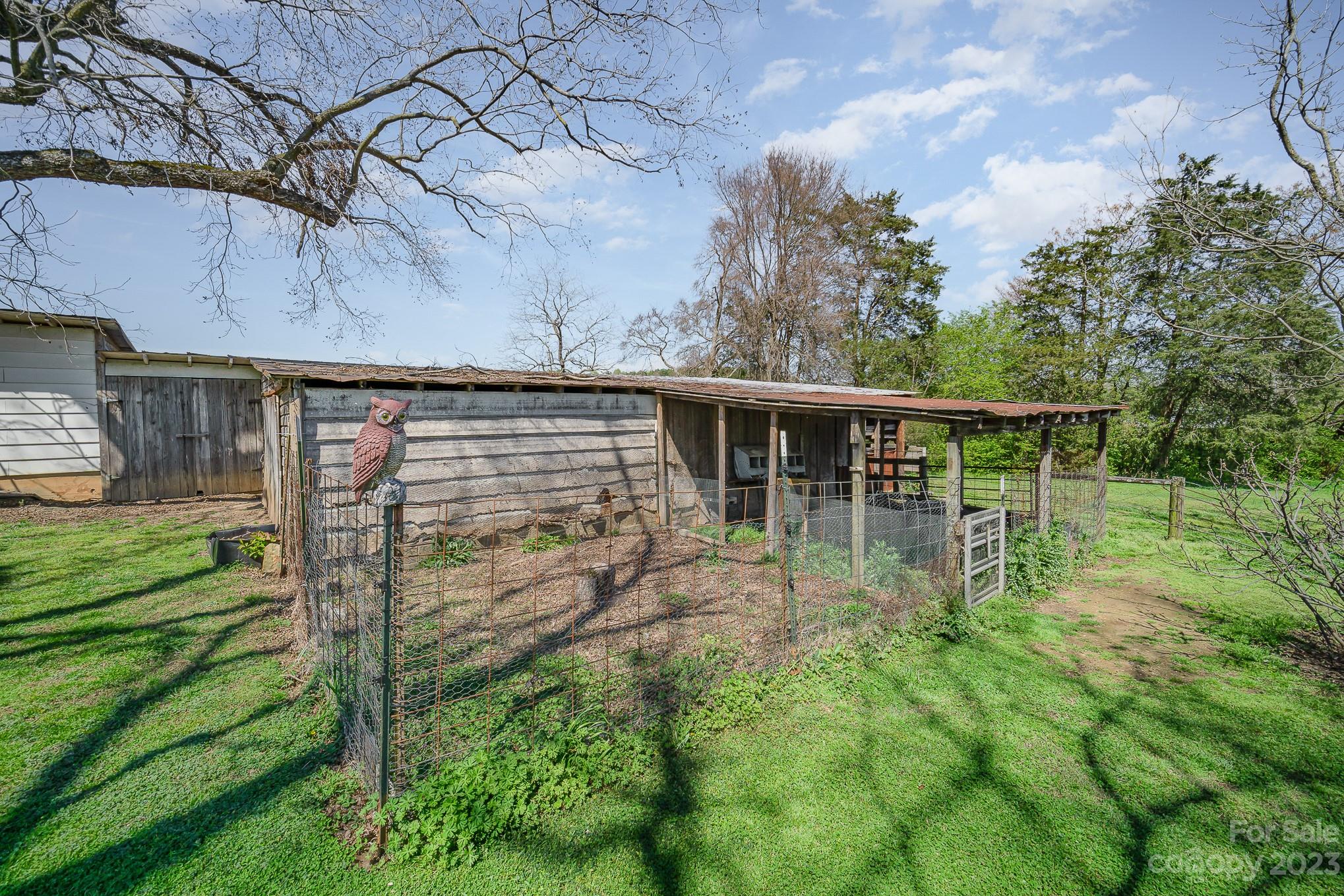 898 Hilltop Road Oakboro, NC 28129 - Photo 11 of 34 a backyard of a house with lots of green space