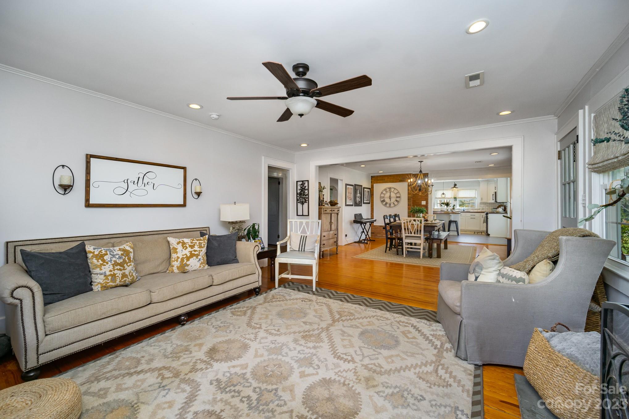 898 Hilltop Road Oakboro, NC 28129 - Photo 17 of 34 a living room with furniture and a large window