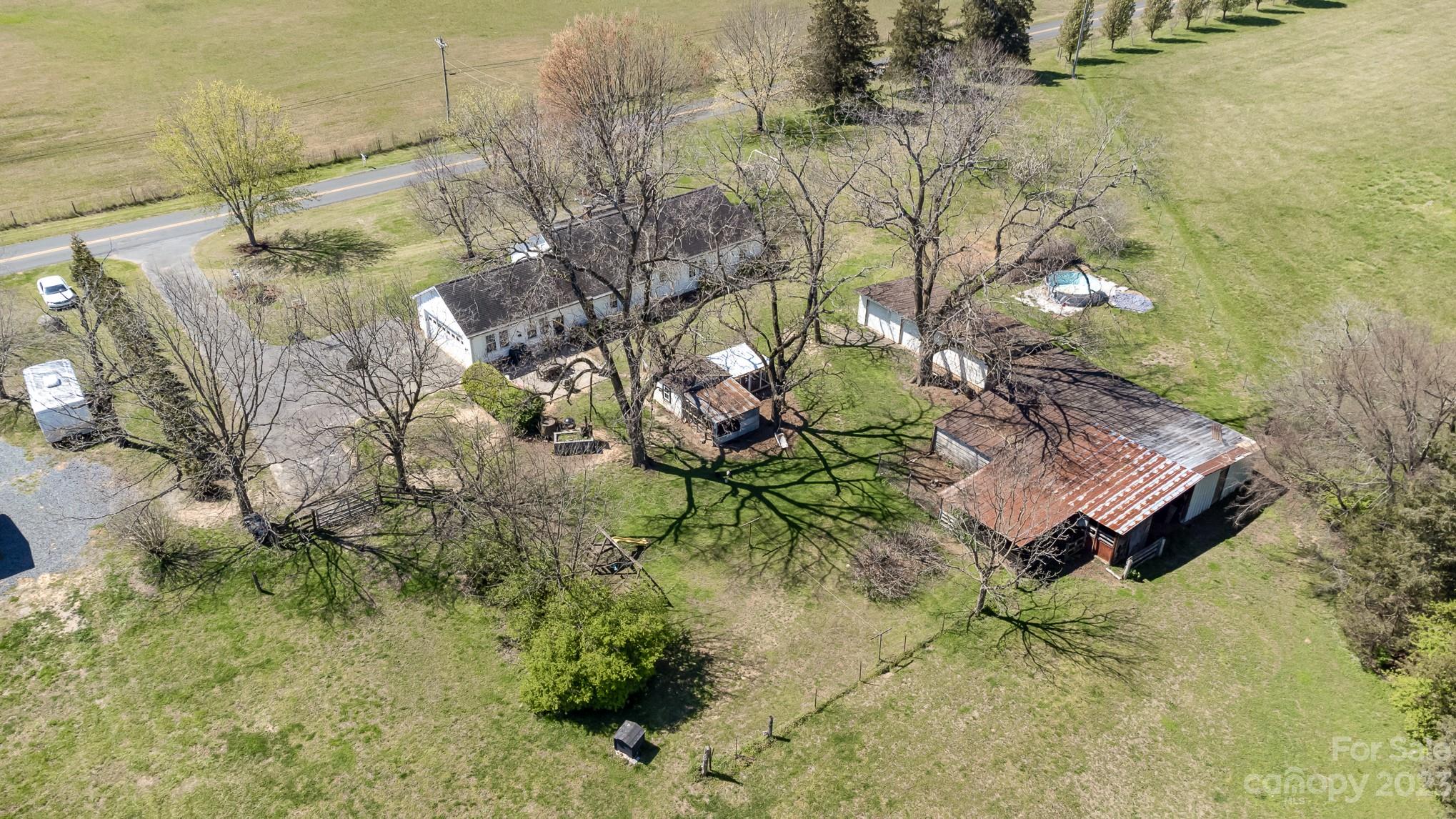 898 Hilltop Road Oakboro, NC 28129 - Photo 2 of 34 a view of a yard in front of the house