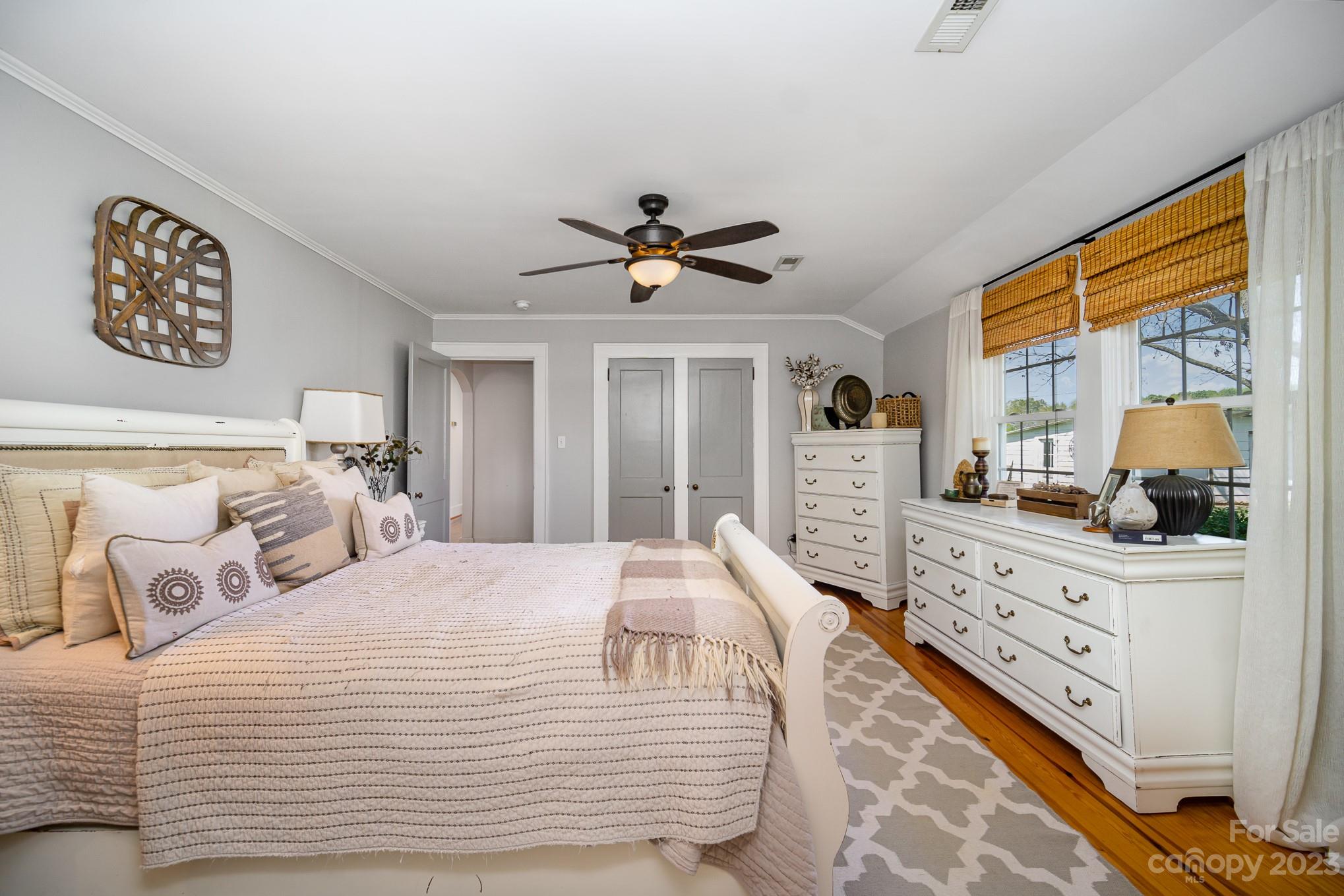 898 Hilltop Road Oakboro, NC 28129 - Photo 26 of 34 a bedroom with a large bed and a window