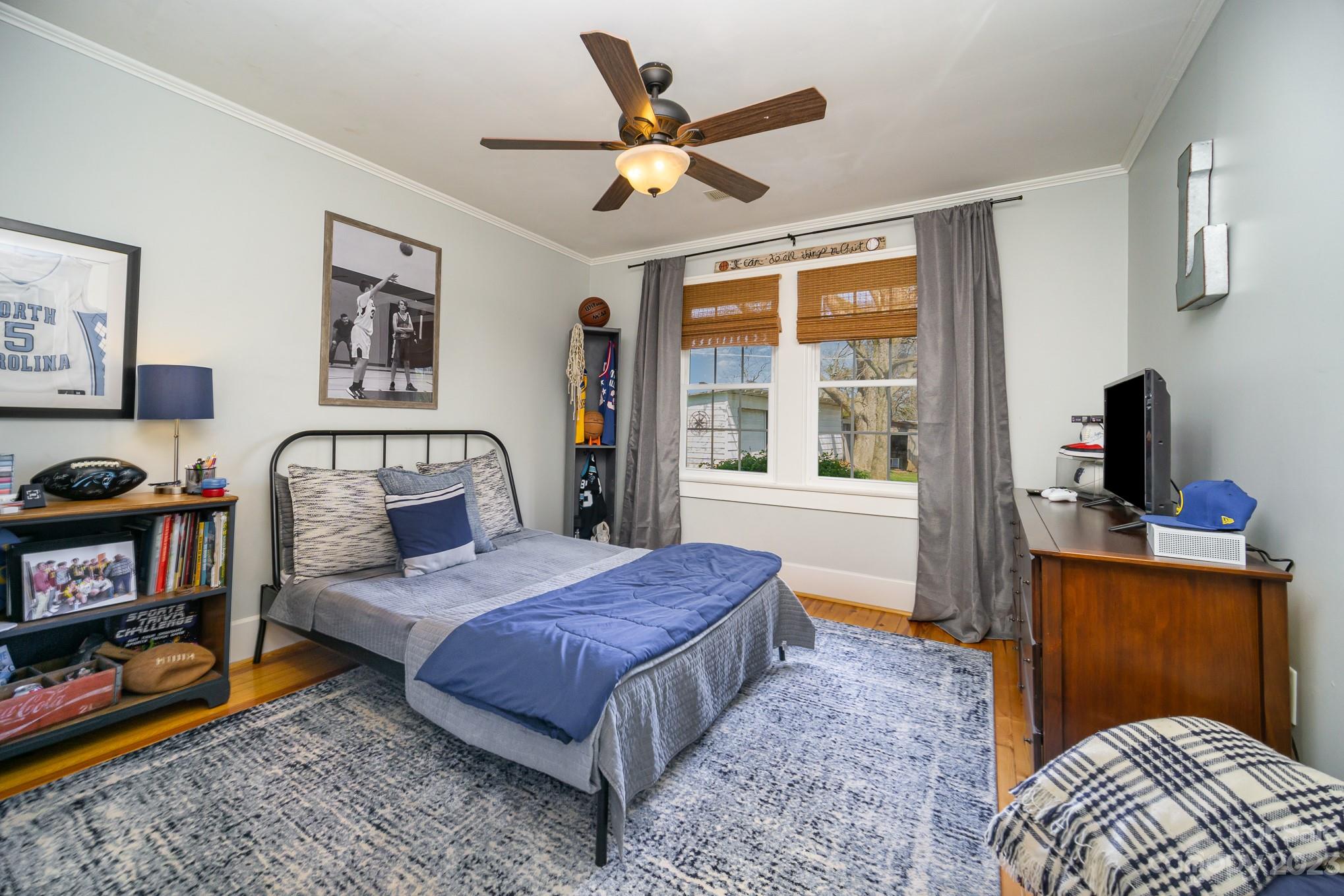 898 Hilltop Road Oakboro, NC 28129 - Photo 30 of 34 a bedroom with a bed dresser and a window