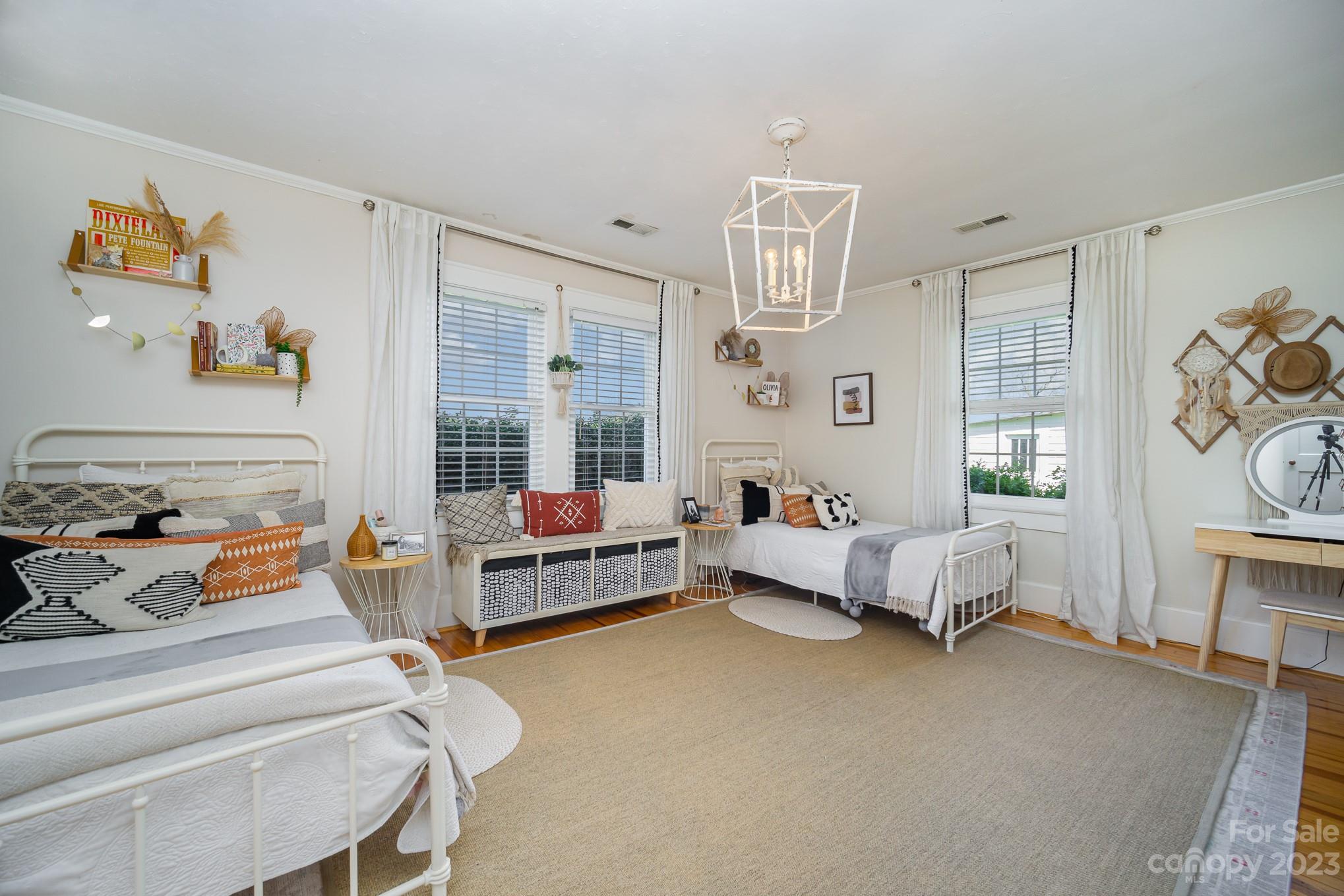 898 Hilltop Road Oakboro, NC 28129 - Photo 31 of 34 a bed room with furniture and a window