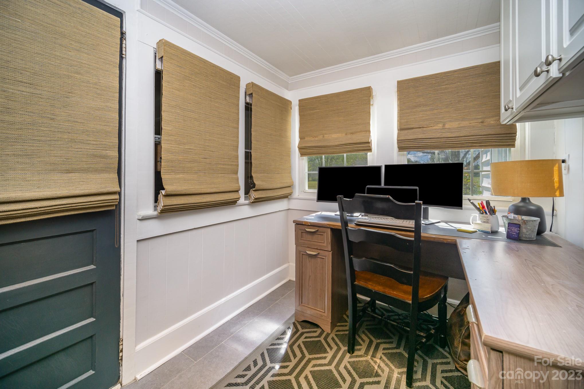 898 Hilltop Road Oakboro, NC 28129 - Photo 34 of 34 a view of a workspace with furniture and a window