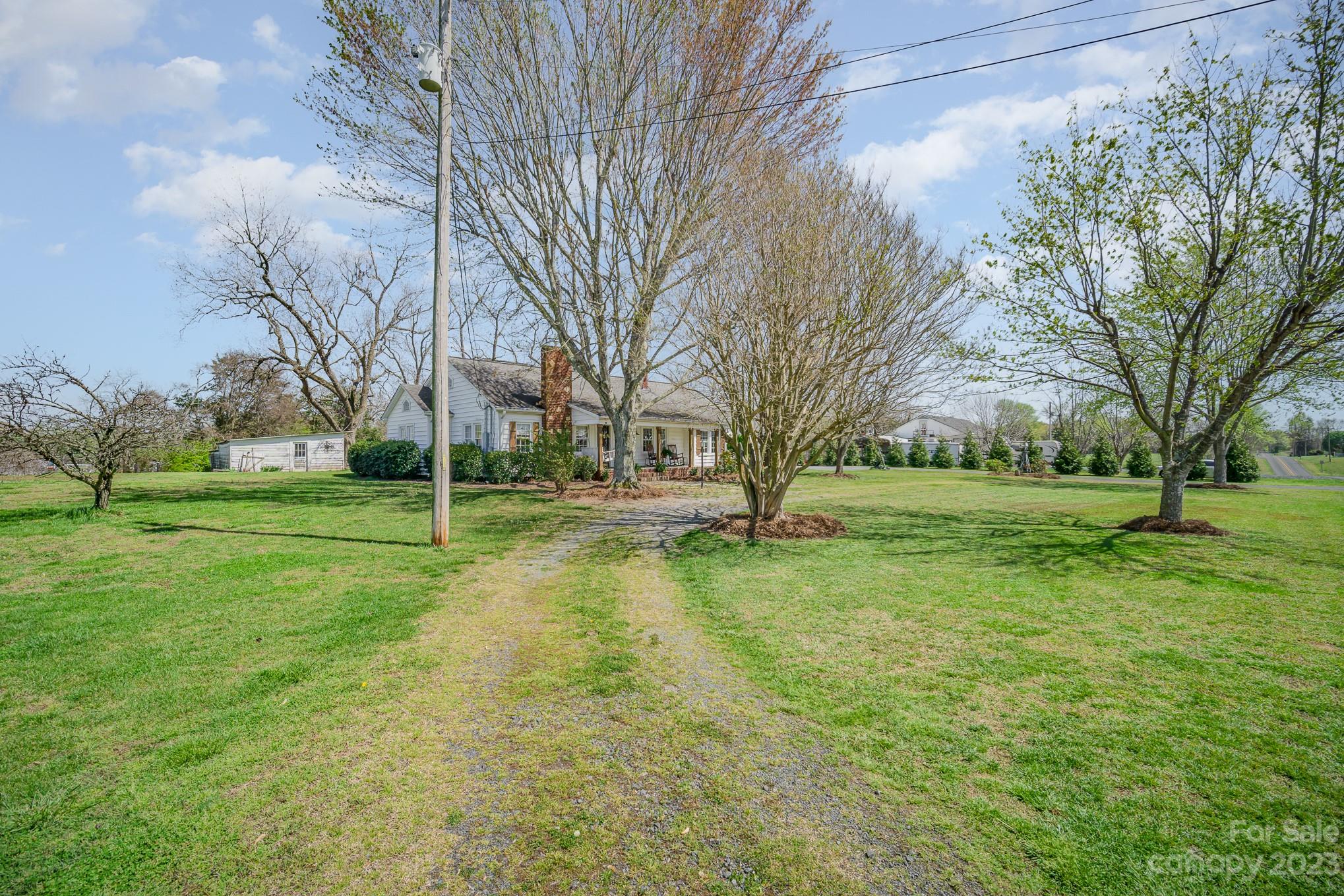 898 Hilltop Road Oakboro, NC 28129 - Photo 5 of 34 a view of yard with tree s