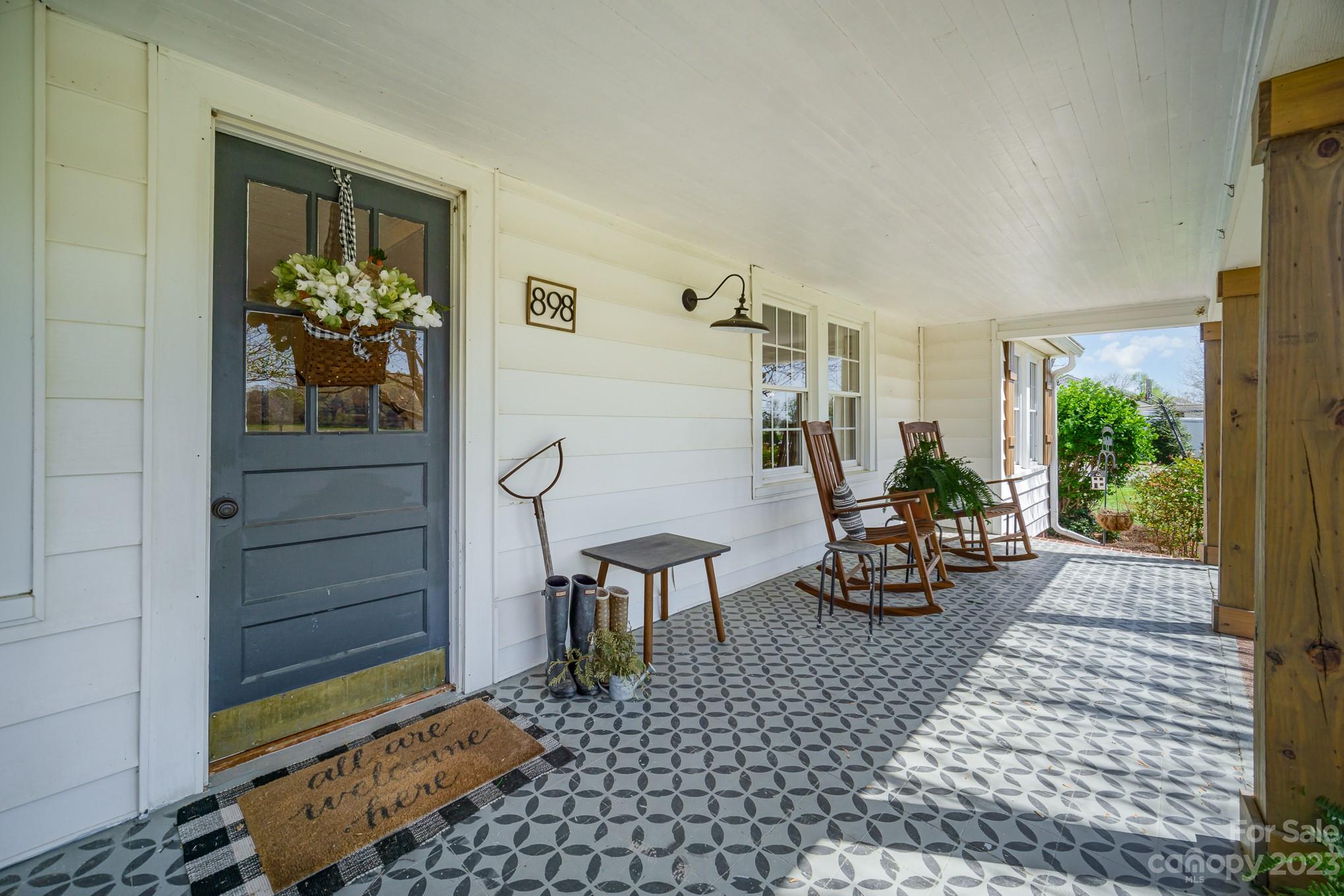 898 Hilltop Road Oakboro, NC 28129 - Photo 7 of 34 a living room with furniture and a table