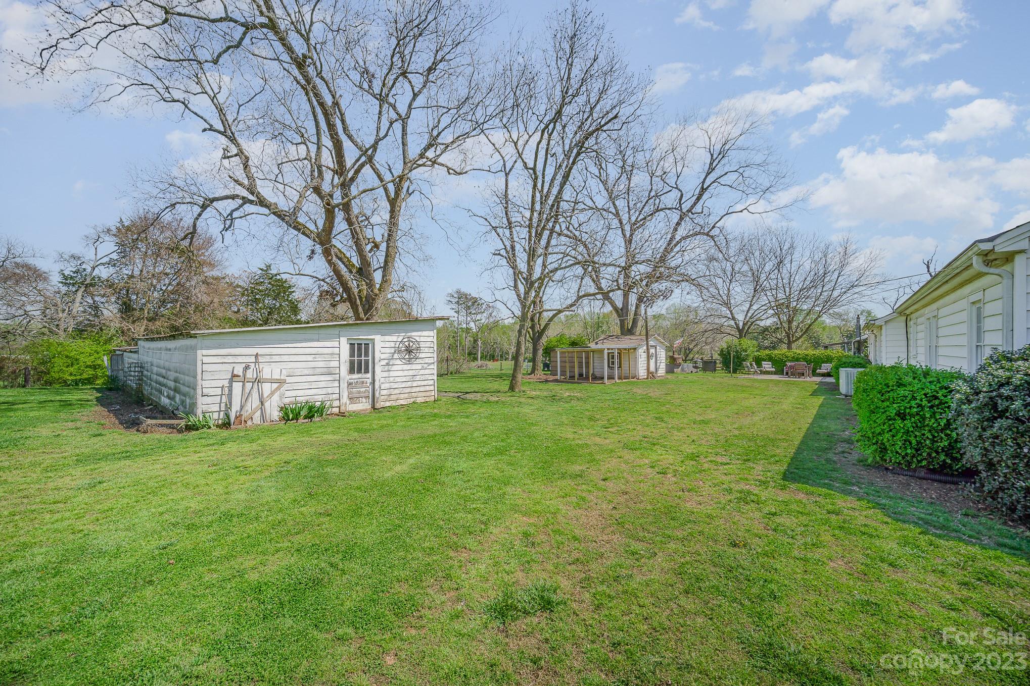 898 Hilltop Road Oakboro, NC 28129 - Photo 8 of 34 a view of a house with backyard