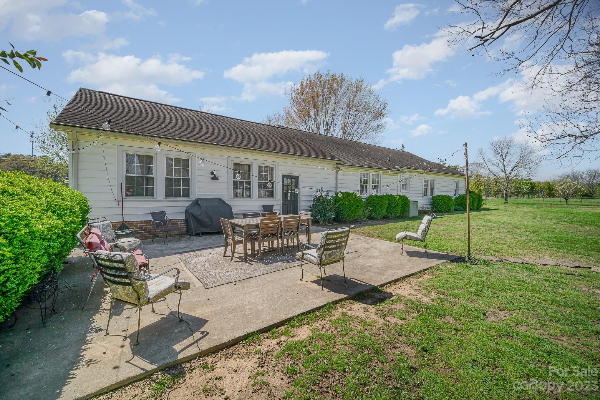 898 Hilltop Road Oakboro, NC 28129 - Photo 9 of 34 a view of backyard with furniture and garden