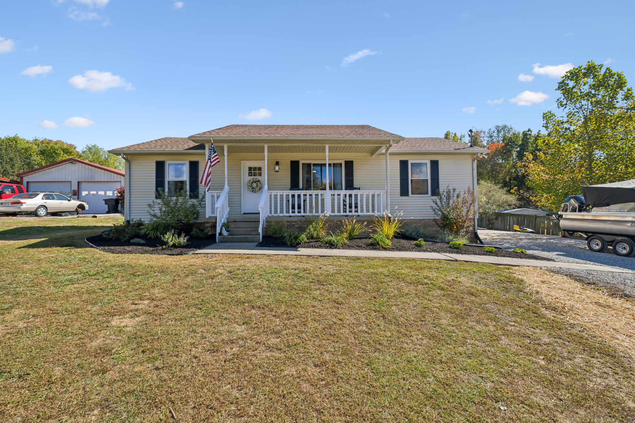 240 Hester Road Portland, TN 37148 - Photo 2 of 51 a front view of a house with garden