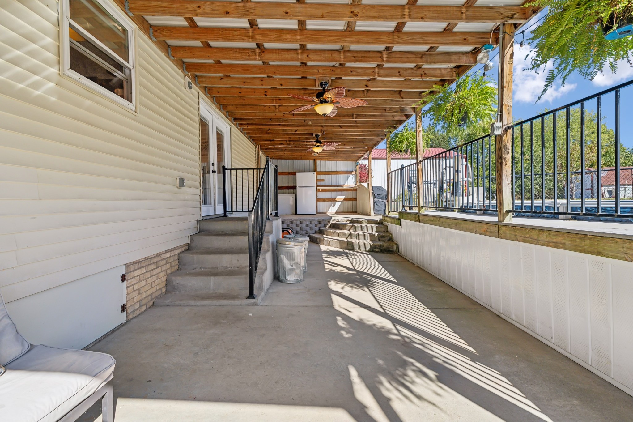 240 Hester Road Portland, TN 37148 - Photo 33 of 51 a view of a porch with wooden floor and iron stairs