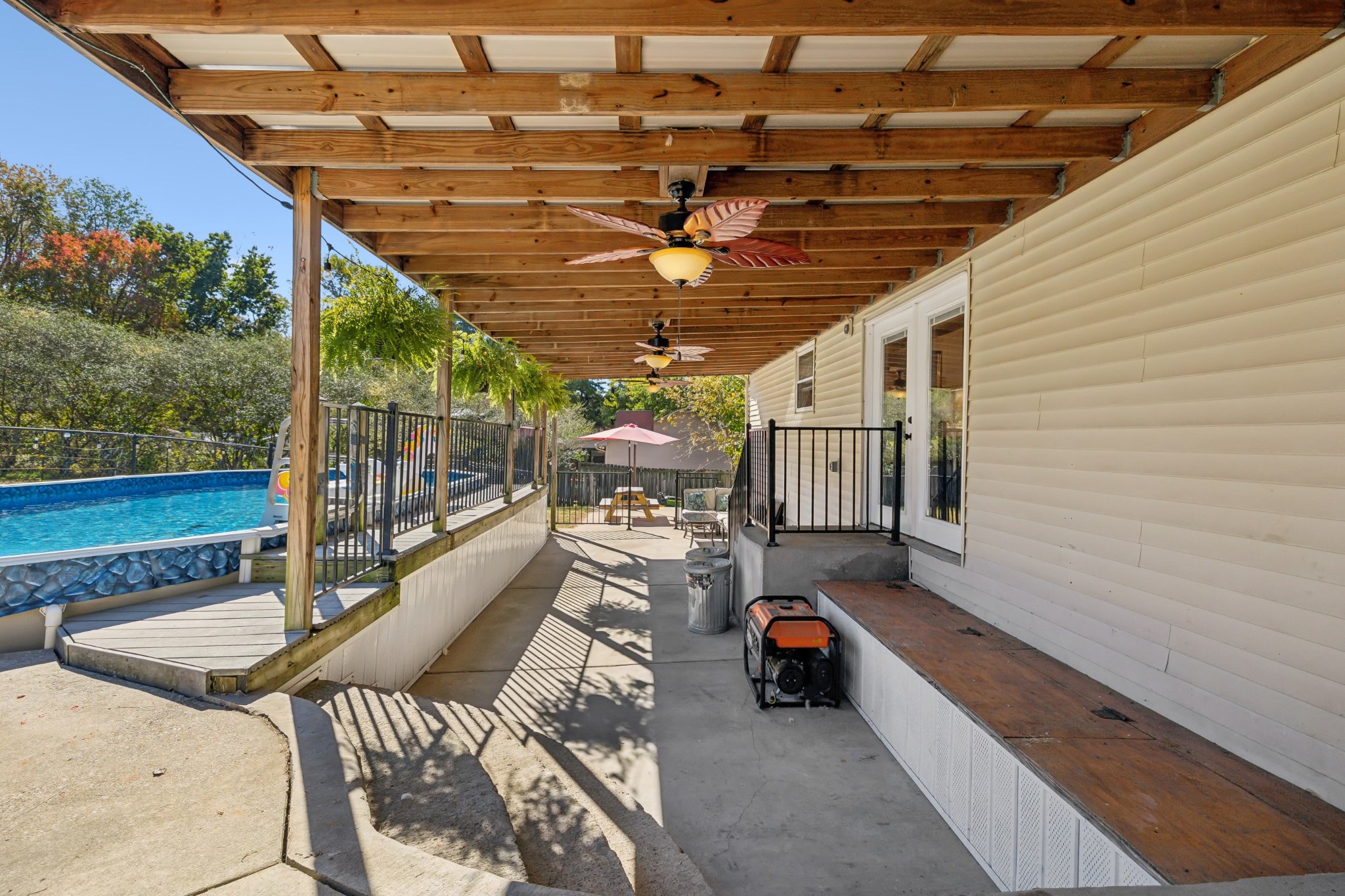240 Hester Road Portland, TN 37148 - Photo 35 of 51 a view of a patio with table and chairs with wooden floor and fence