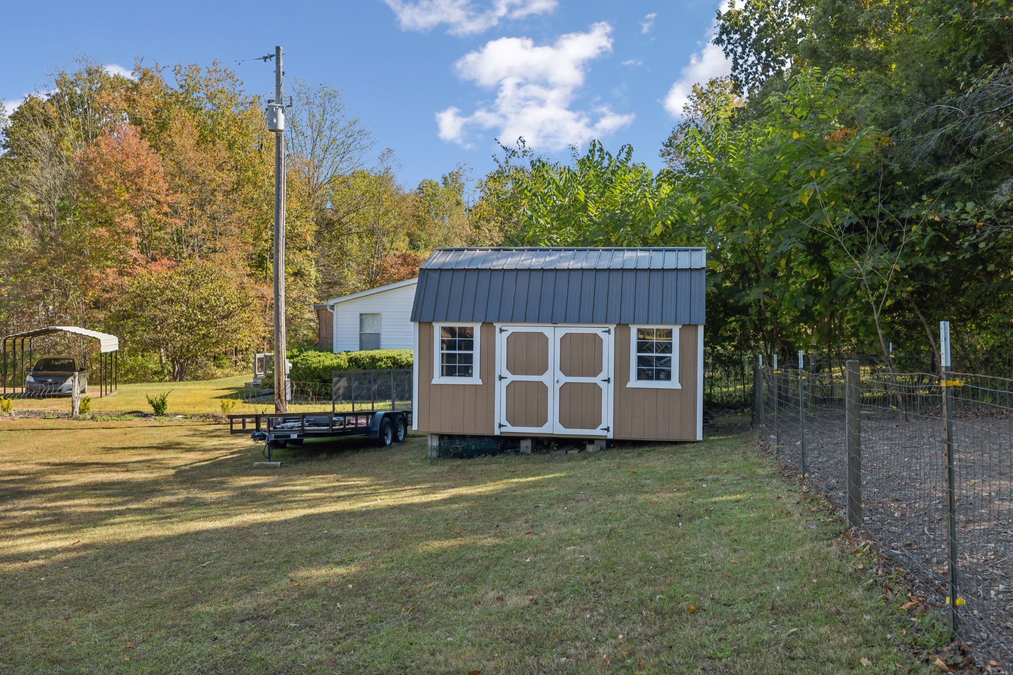 240 Hester Road Portland, TN 37148 - Photo 46 of 51 a view of a house with backyard and trees