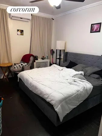 a bedroom with bed and a window