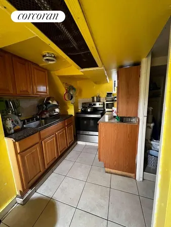 a kitchen with stainless steel appliances granite countertop a sink counter space and cabinets