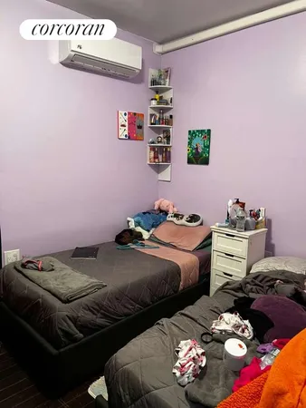 a bedroom with bed and a couch