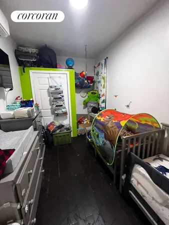 a bedroom with bed and a window