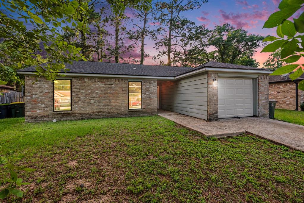 1321 North 7th Street Conroe, TX 77301 - Photo 1 of 17 a view of a house with a yard