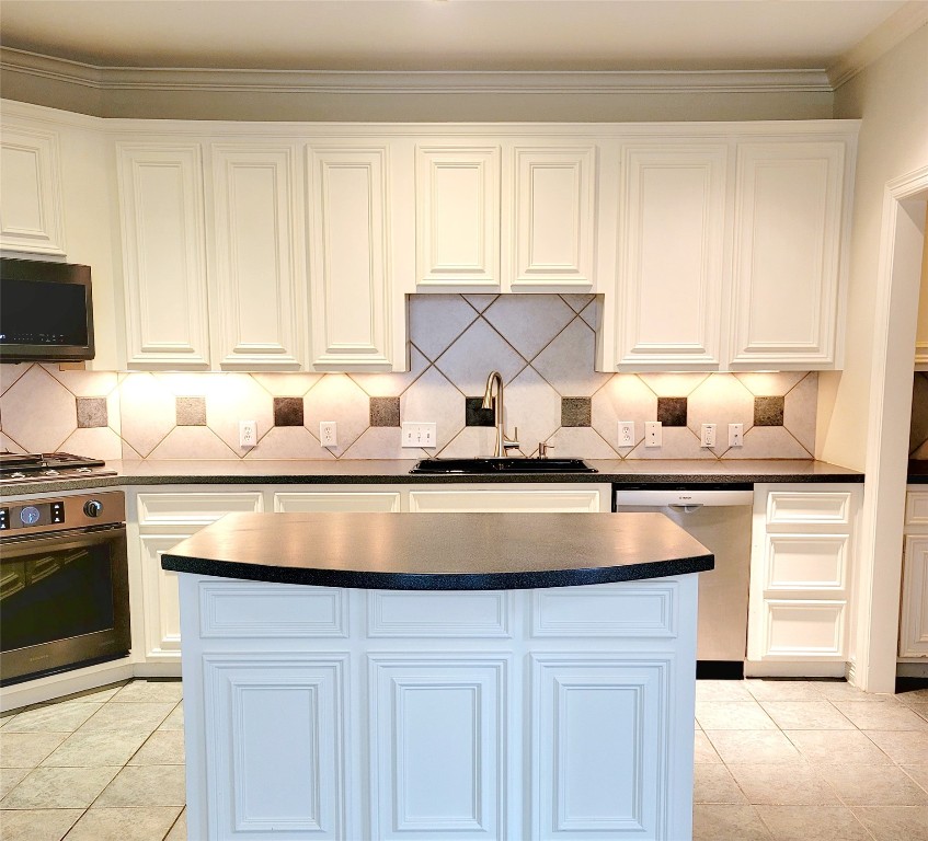1526 Nevada Street Houston, TX 77006 - Photo 11 of 38 a kitchen with a sink cabinets and a window
