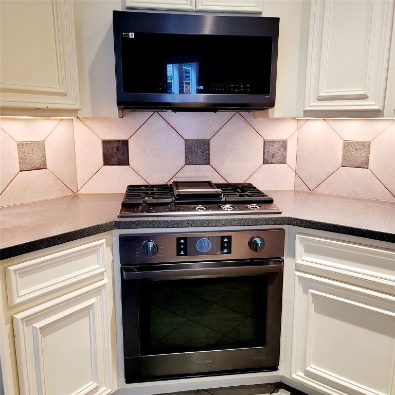 1526 Nevada Street Houston, TX 77006 - Photo 13 of 38 a stove top oven sitting inside of a kitchen