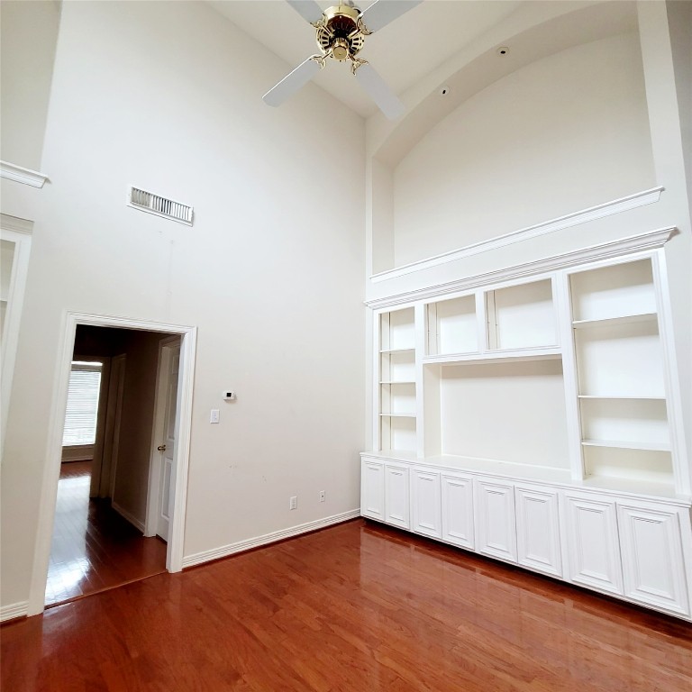 1526 Nevada Street Houston, TX 77006 - Photo 16 of 38 a view of an empty room with a window and wooden floor