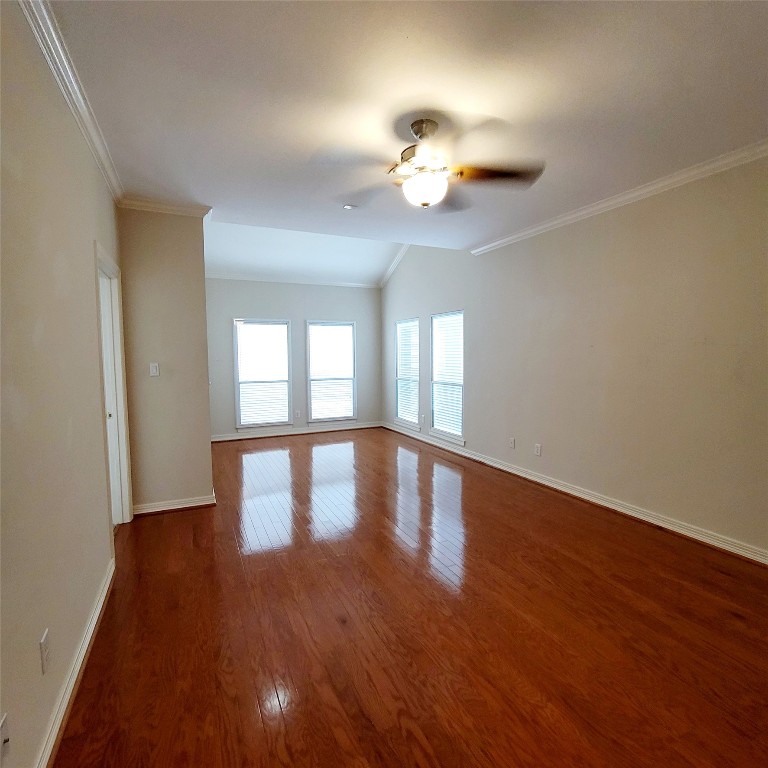 1526 Nevada Street Houston, TX 77006 - Photo 20 of 38 a view of an empty room with wooden floor and a window