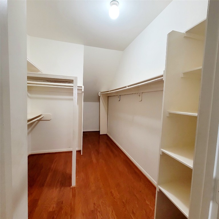 1526 Nevada Street Houston, TX 77006 - Photo 27 of 38 a view of walk in closet with wooden floor