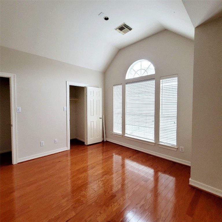 1526 Nevada Street Houston, TX 77006 - Photo 28 of 38 an empty room with wooden floor and window