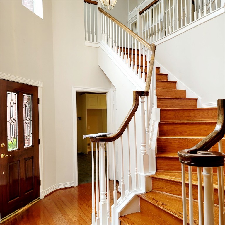 1526 Nevada Street Houston, TX 77006 - Photo 5 of 38 a view of entryway with wooden floor and stairs