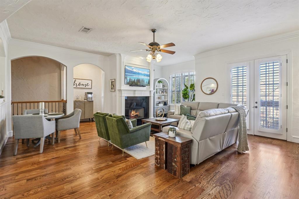 612 Rockingham Drive Irving, TX 75063 - Photo 13 of 39 a living room with furniture a fireplace and wooden floor