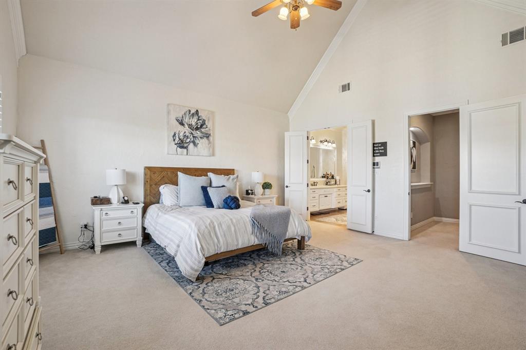 612 Rockingham Drive Irving, TX 75063 - Photo 26 of 39 a spacious bedroom with a bed and a couch