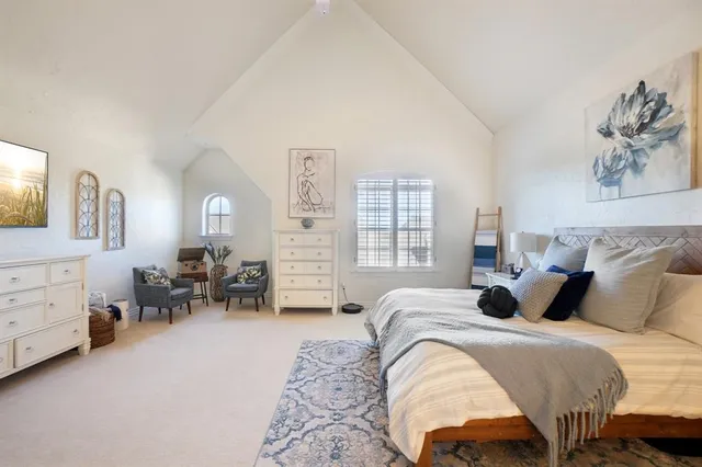 a bedroom with bed and furniture