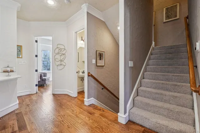 a view of an entryway with wooden floor and a livingroom view