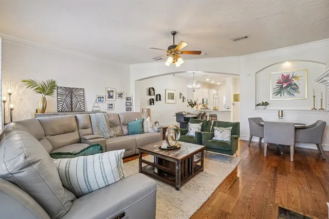 a living room with furniture kitchen view and a dining table
