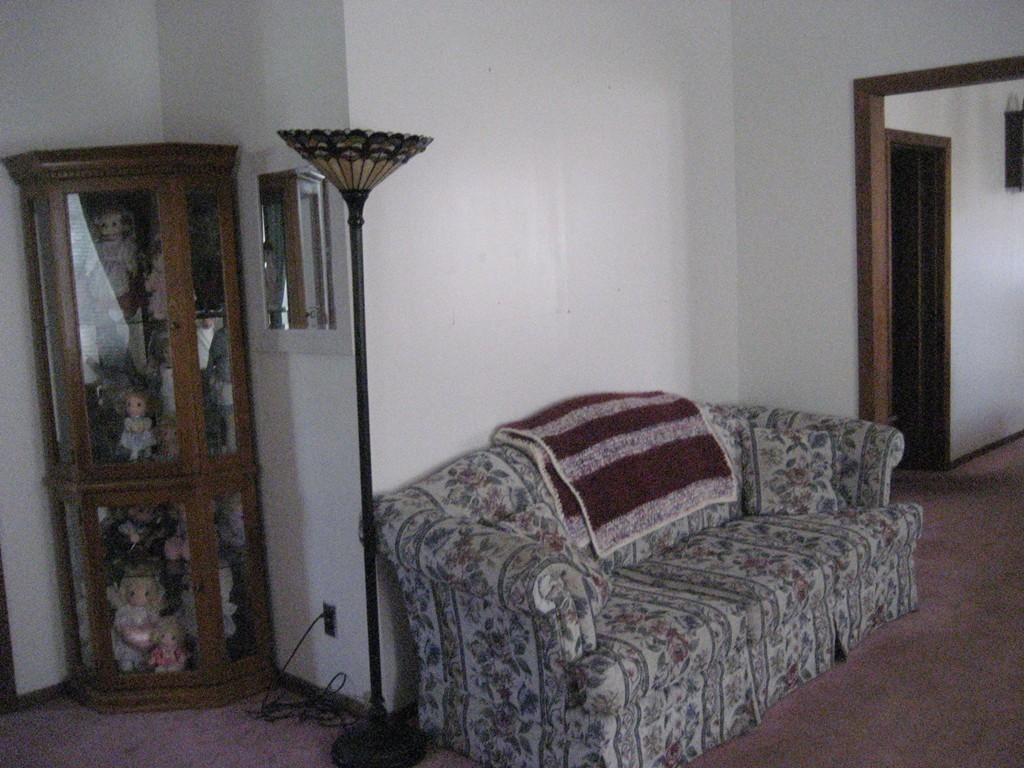11 Clinton Street Everett, MA 02149 - Photo 11 of 25 a bed sitting in a bedroom next to a window
