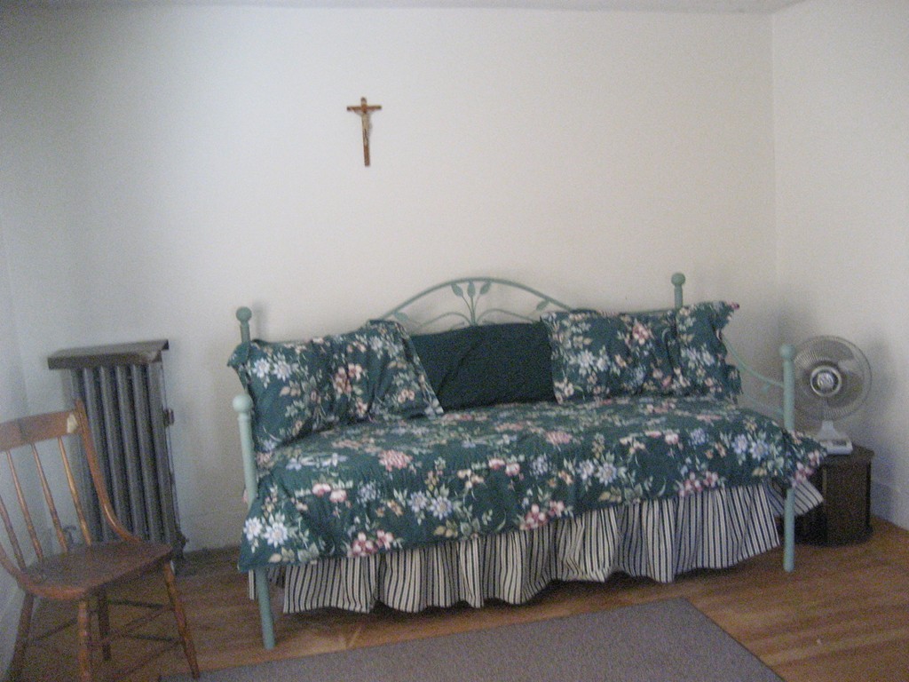 11 Clinton Street Everett, MA 02149 - Photo 20 of 25 a bedroom with a bed and a chandelier