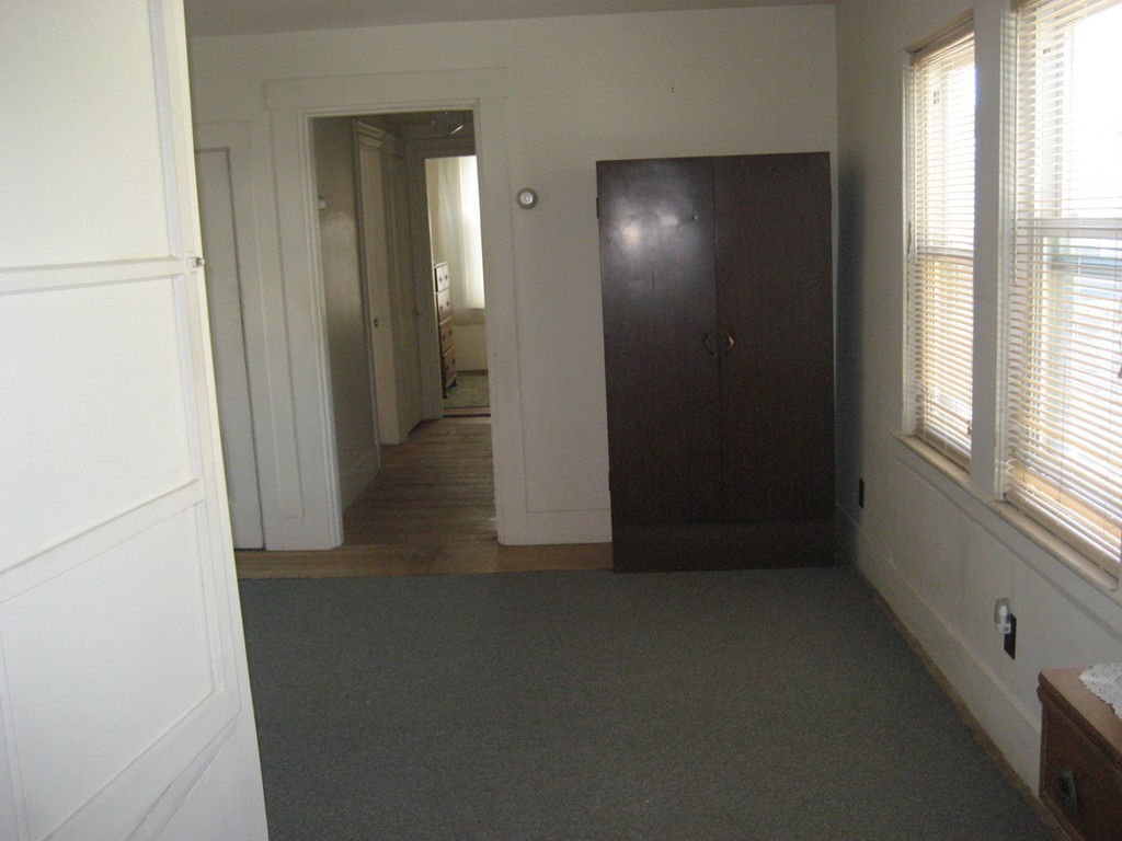 11 Clinton Street Everett, MA 02149 - Photo 21 of 25 an empty room with windows and closet