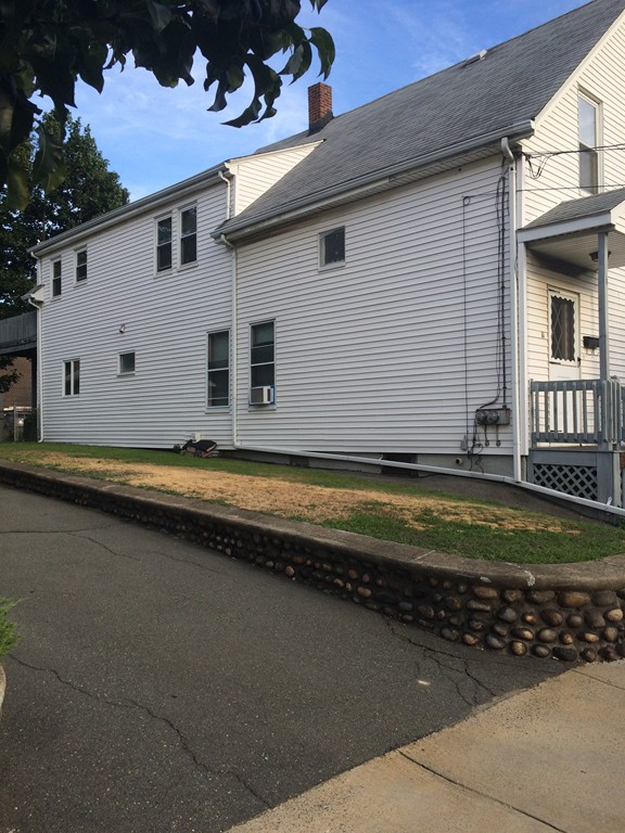 11 Clinton Street Everett, MA 02149 - Photo 3 of 25 a view of a house with backyard and sitting area